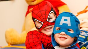 kids dressed up as super heroes