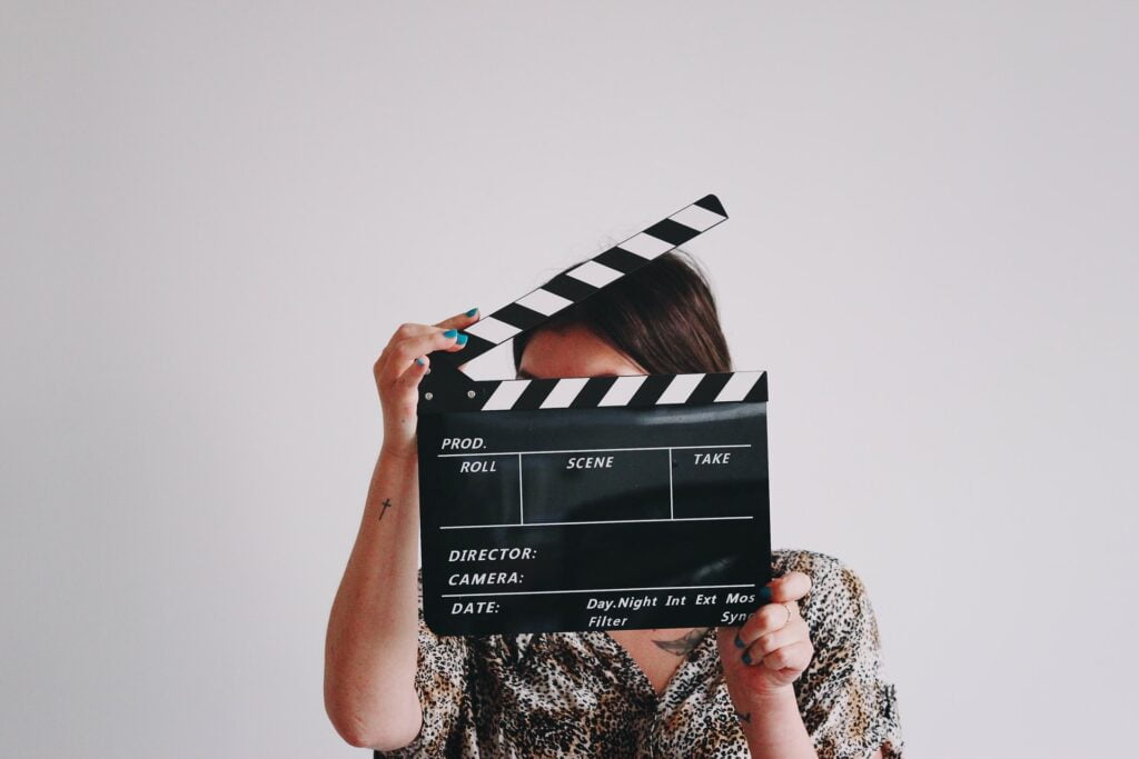 Woman looking through a clapboard